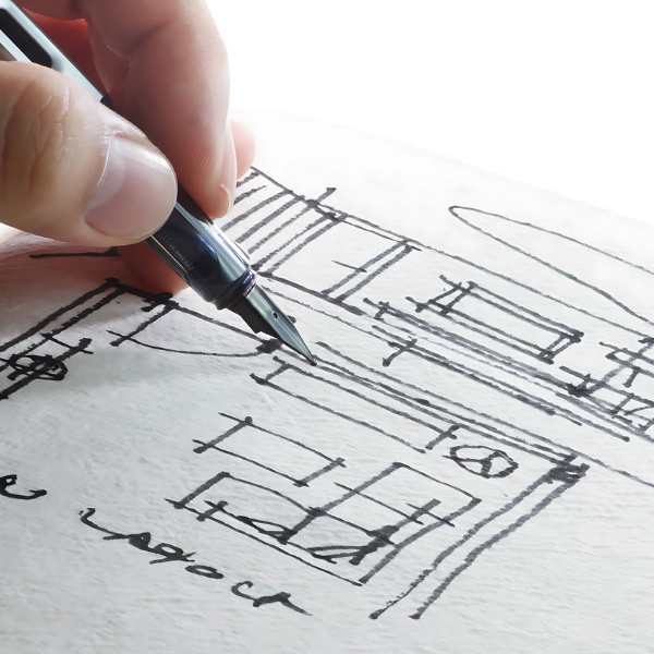 Hand drawing floor plan with pen on paper